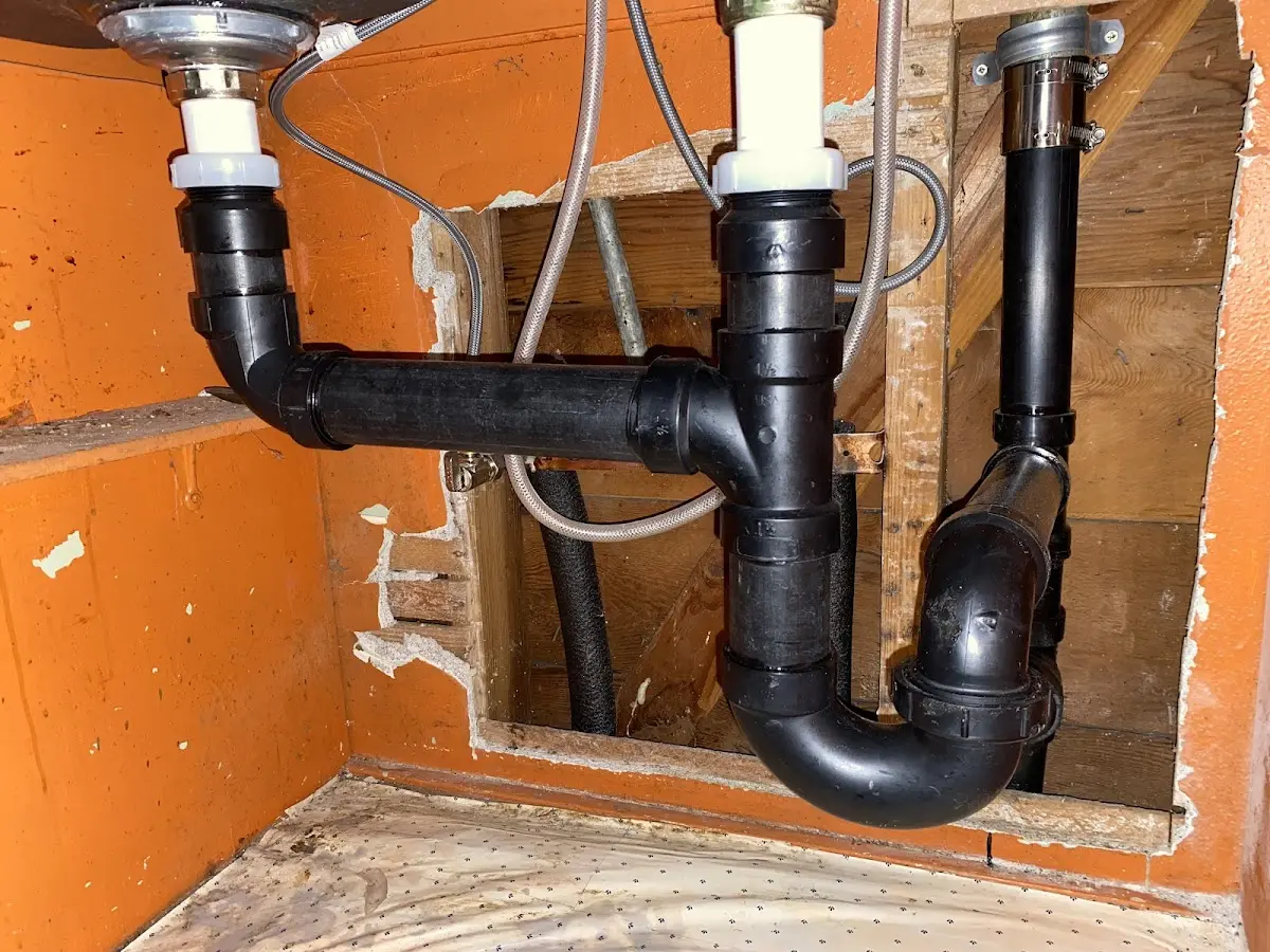 Professional Garbage Disposal Repair equipment and tools on the job in Long Beach